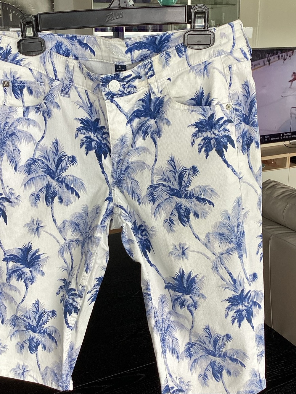 Tommy Bahama tropical blue and white print bermuda shorts.